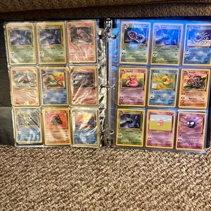 Binder of fossil series Pokémon cards.